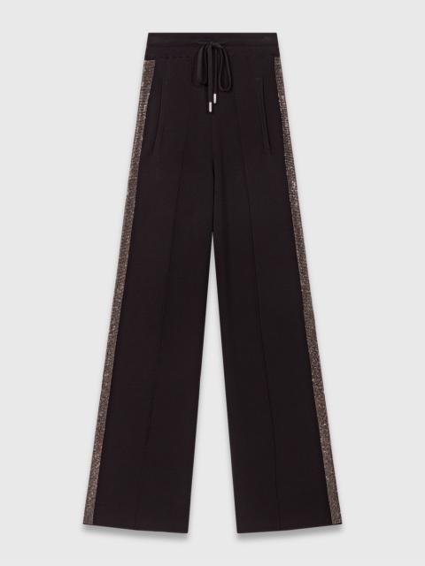 Trousers with rhinestone band