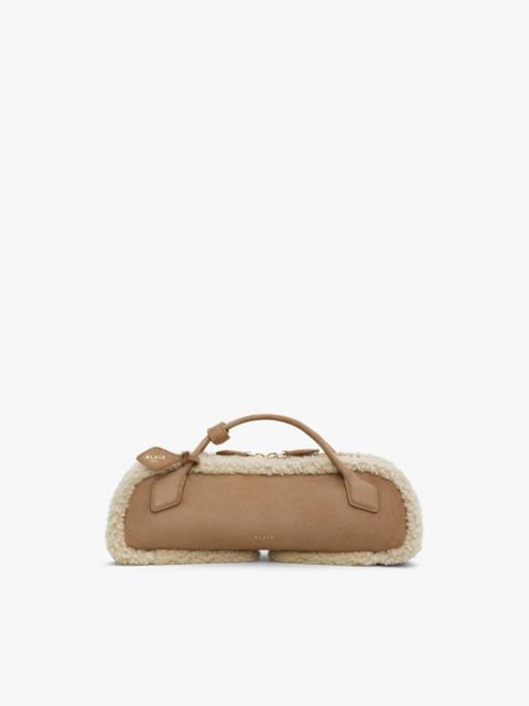 LE TECKEL CLUTCH IN MERINO SHEARLING