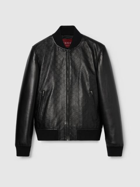 Embossed GG leather bomber jacket