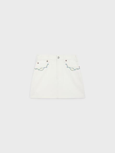 embroidered mini skirt in raw wash white denim