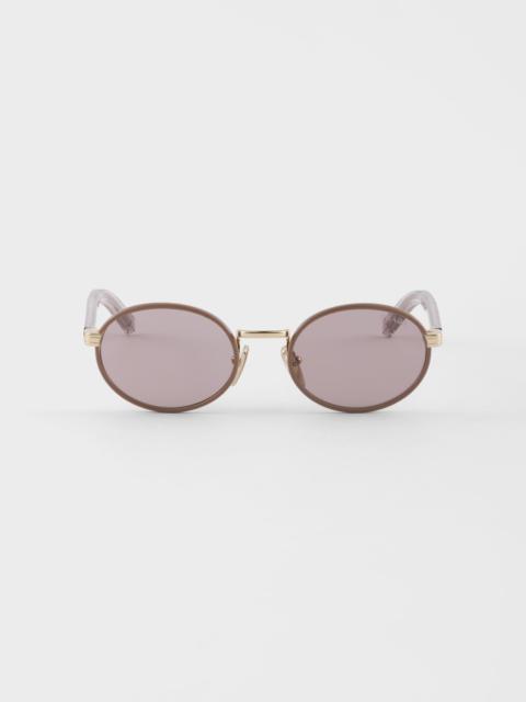 Prada sunglasses with the iconic metal plaque
