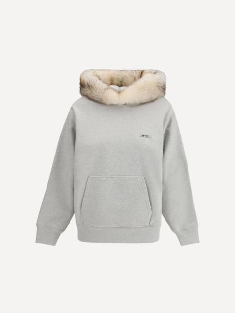 Hoodie features a hood lined in shearling
