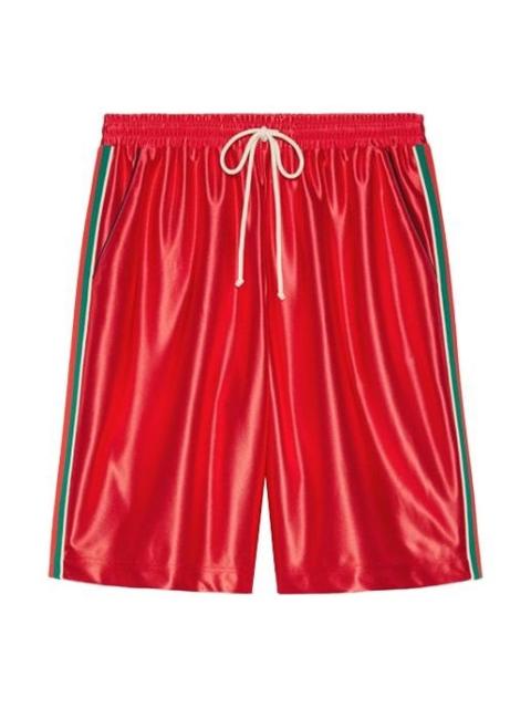 Shiny jersey shorts with Web