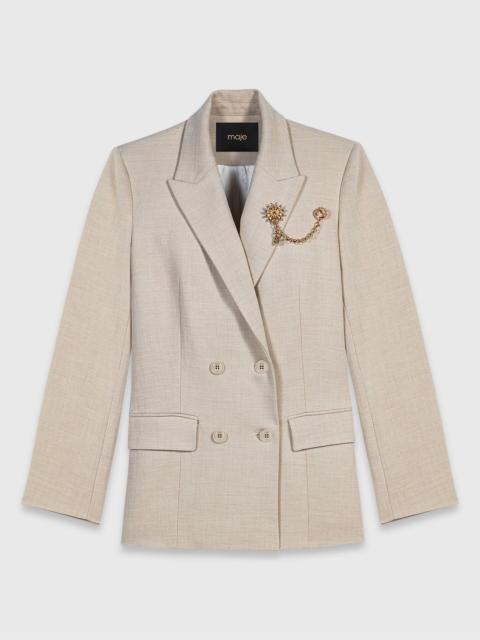 Suit jacket with brooch