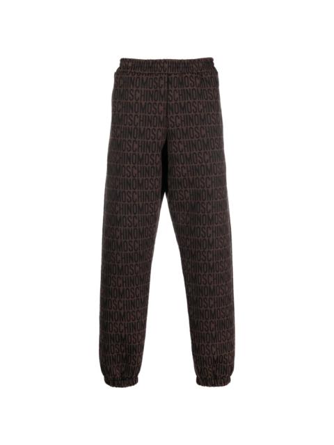 all-over embroidered logo track pants