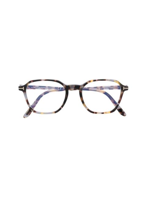 tortoiseshell-effect round-frame glasses