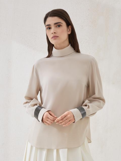 Silk crêpe de Chine turtleneck T-shirt with precious bracelets