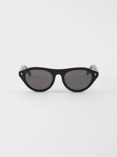 Prada sunglasses with the iconic metal plaque