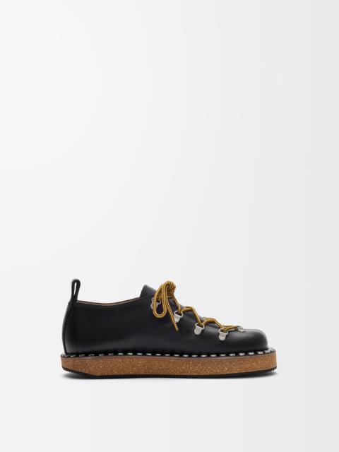 Rivet lace-up in vegetable-tanned calfskin