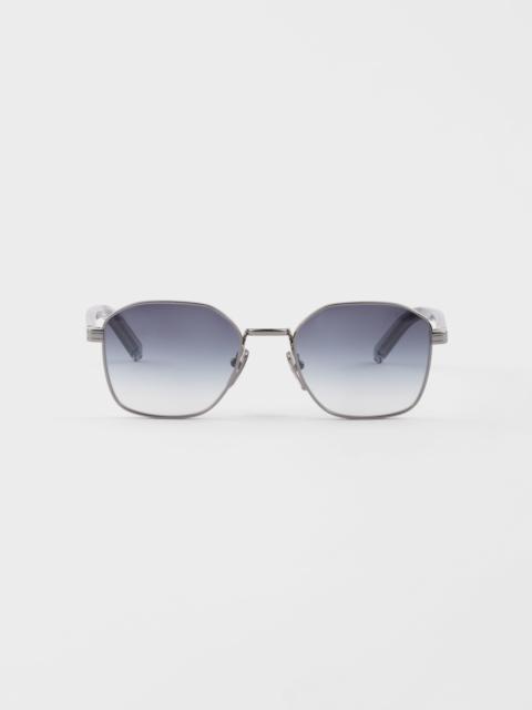 Sunglasses with the iconic metal plaque
