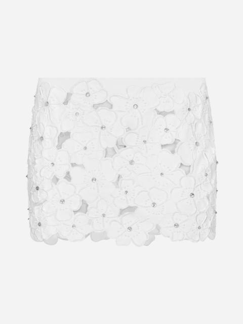 Cotton miniskirt with floral embroidery and rhinestone embellishment