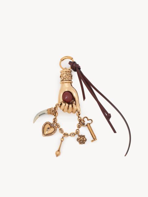 CHLOÉ SYMBOLS HAND BAG CHARM IN BRASS