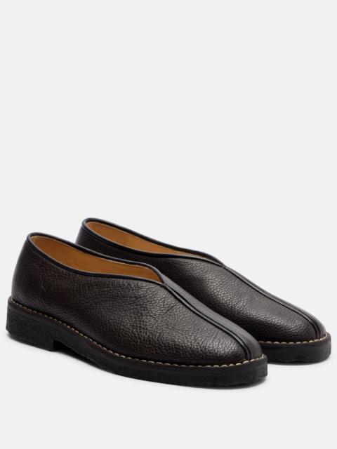 Piped leather slip-on shoes