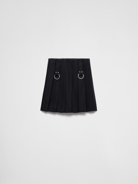 Pleated gabardine miniskirt with metal rings