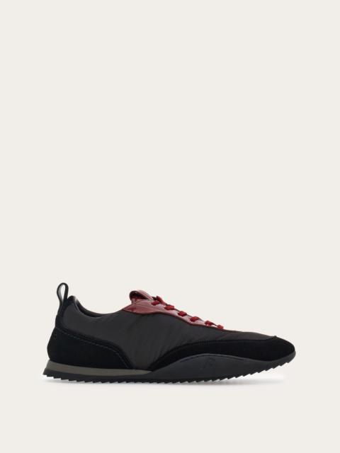 Sneaker with patent leather trim
