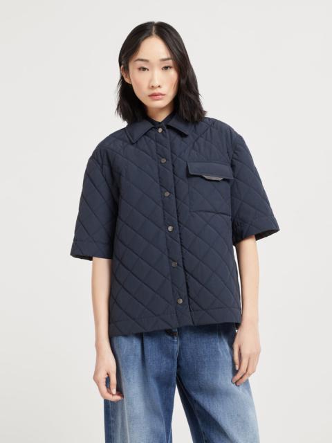 Water-resistant techno cotton short sleeve outerwear jacket with Thermore® padding and shiny flap de