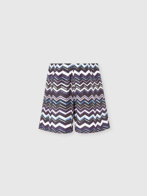 Long swim shorts with irregular zigzag print