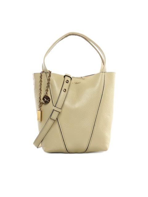 Spin charm shoulder bag
