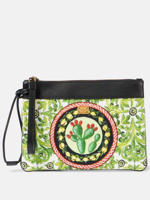 Printed leather-trimmed canvas clutch
