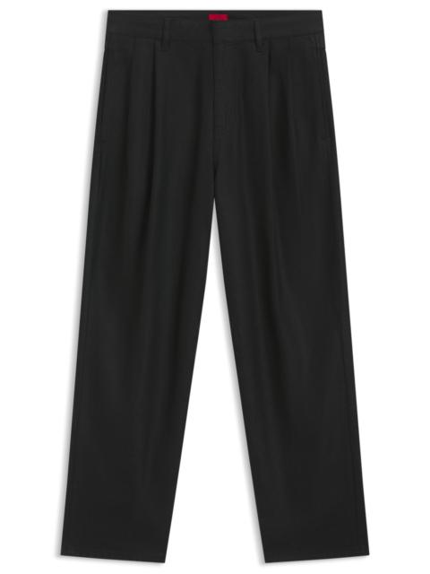 RELAXED-FIT JEANS IN BLACK WAXED DENIM