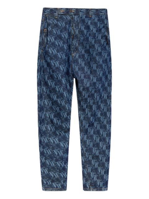 monogram-pattern tapered jeans