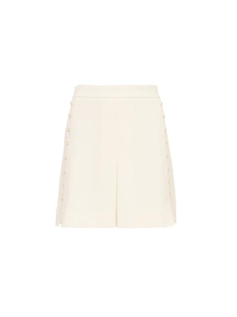 BUTTON-DETAILED MINI SKIRT