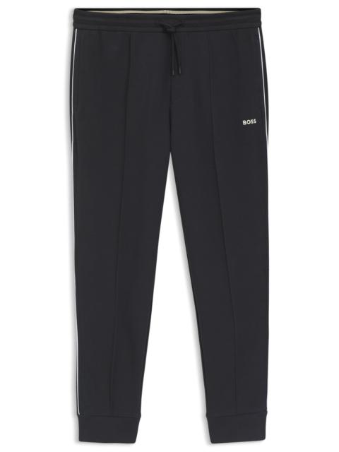 PIPING-DETAIL TRACKSUIT BOTTOMS IN A COTTON BLEND