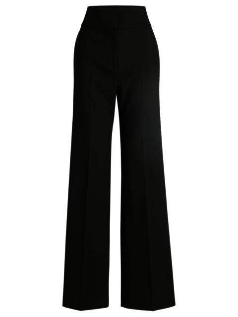 REGULAR-FIT TROUSERS WITH FLARED LEG