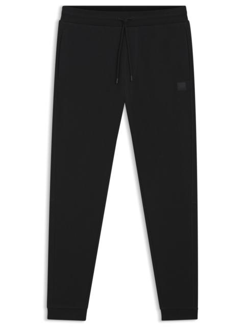 COTTON-TERRY TRACKSUIT BOTTOMS WITH LOGO PATCH
