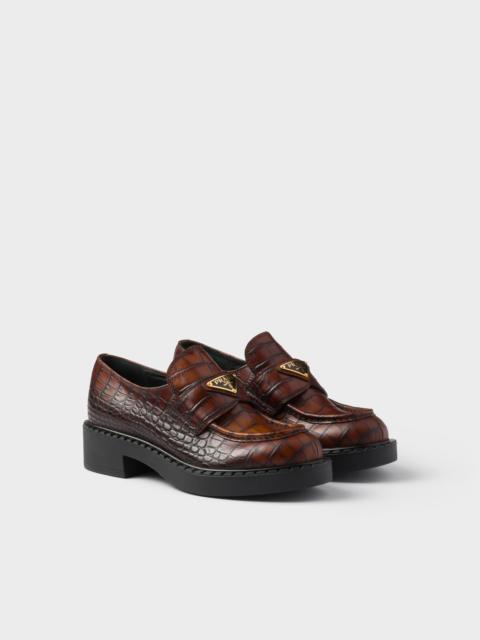 Chocolate crocodile-print leather loafers
