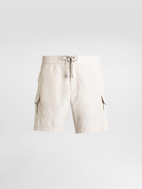 Mid-length swim trunks with tag