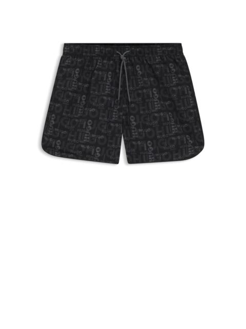 SWIM SHORTS WITH ALL-OVER PRINT