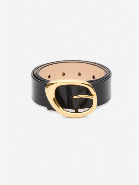 Fluid buckle leather belt in black and gold