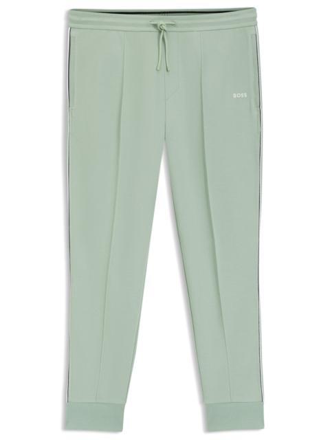 PIPING-DETAIL TRACKSUIT BOTTOMS IN A COTTON BLEND