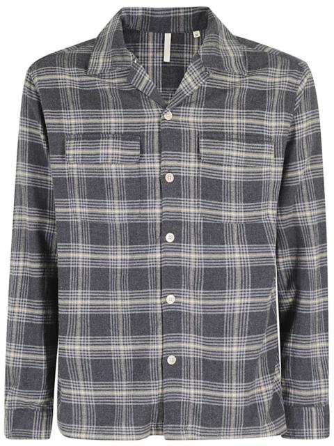 buttoned plaid shirt