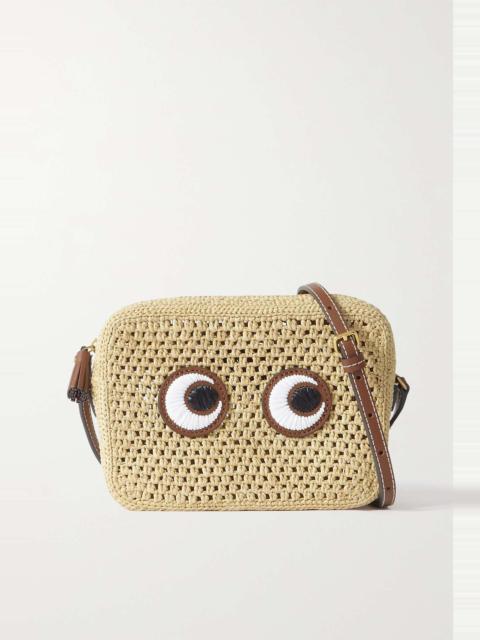 Eyes embroidered leather-trimmed raffia shoulder bag