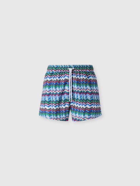Mid-length swim shorts with irregular zigzag print