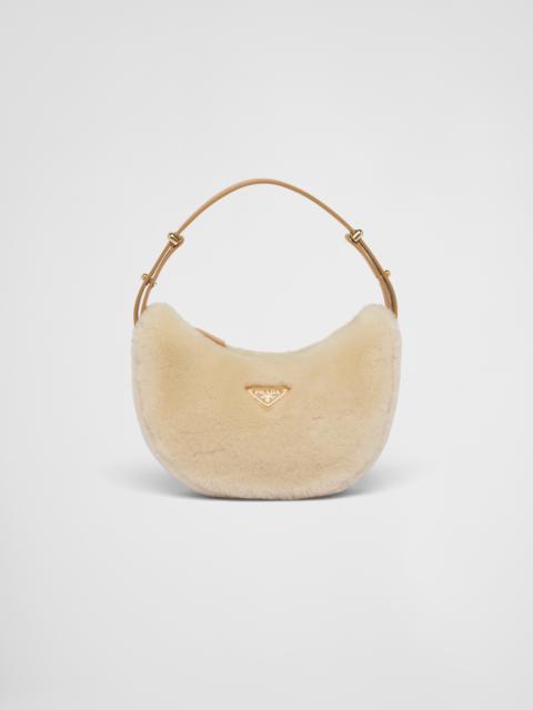 Prada Arqué shearling and leather shoulder bag