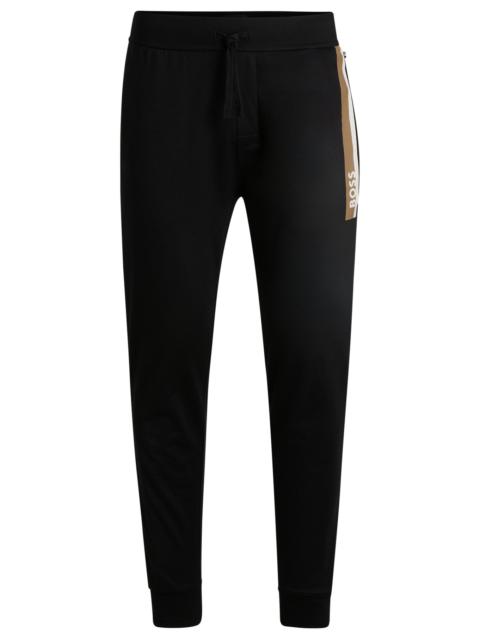 COTTON-TERRY TRACKSUIT BOTTOMS WITH STRIPE PRINT