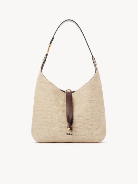 SMALL MARCIE HOBO BAG IN RAFFIA-EFFECT FIBERS