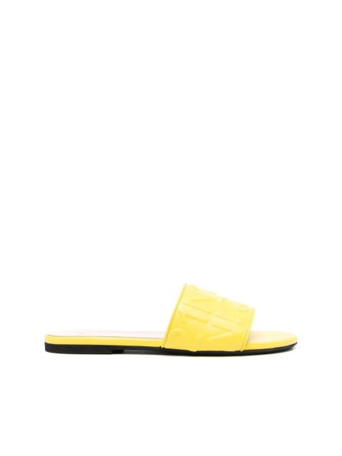 logo-embossed leather slides