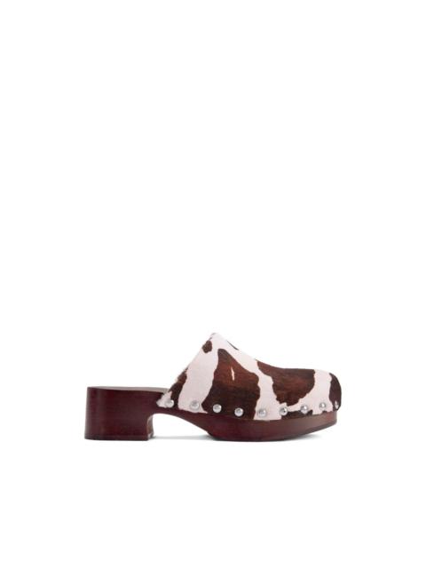Rio cow-print wood clog mules