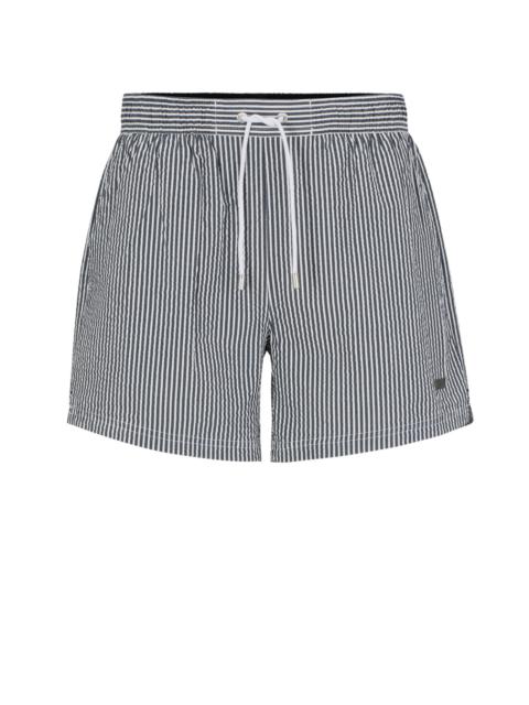 SEERSUCKER STRIPED SWIM SHORTS WITH LOGO BADGE