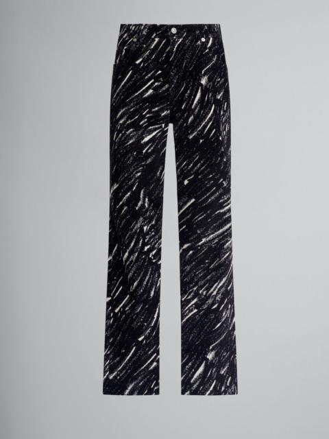 BLACK FLOCKED JEANS WITH CRAYON PRINT