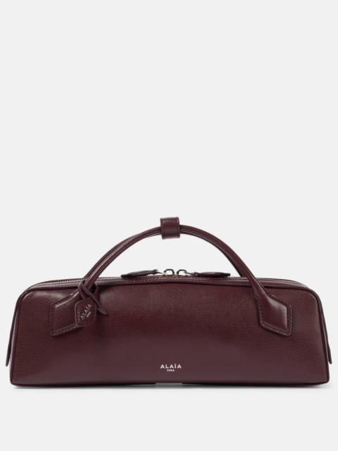 Le Teckel leather clutch