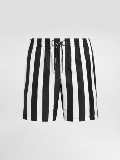 Mid-length swim trunks with striped print