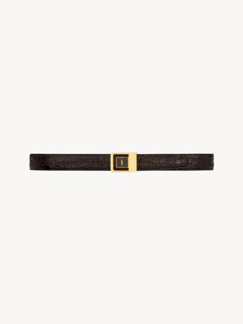 female buckle belt in crocodile-embossed leather