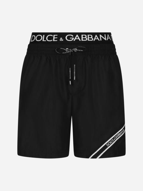 Mid-length swim trunks with branded band