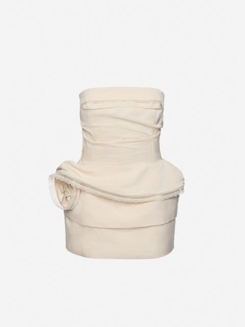 Strapless mini dress with lace-trimmed peplum in cream