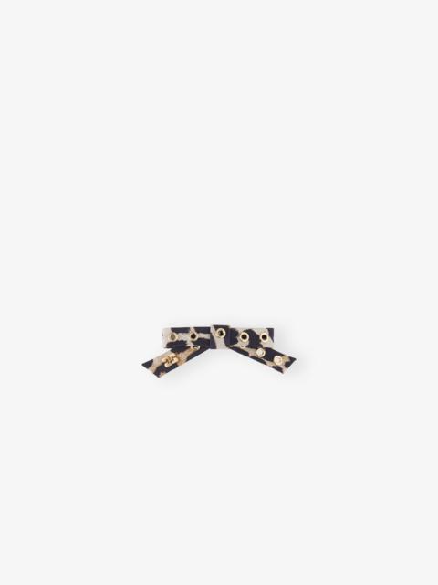 LEOPARD EYELET BOW BARRETTE